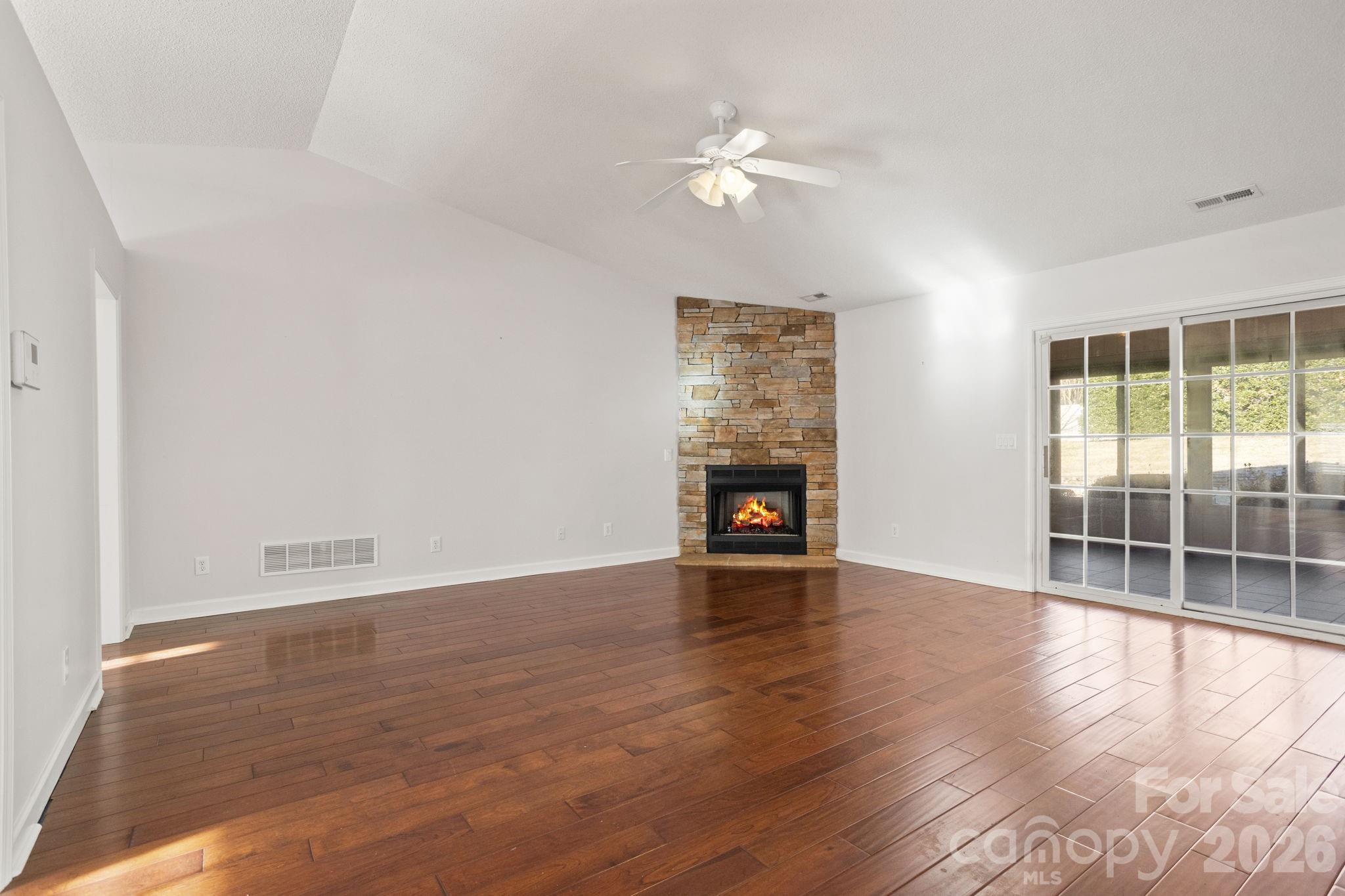 32 Stone House Road Hendersonville, NC 28739 - Photo 12 of 31 wooden floor in an empty room with a window