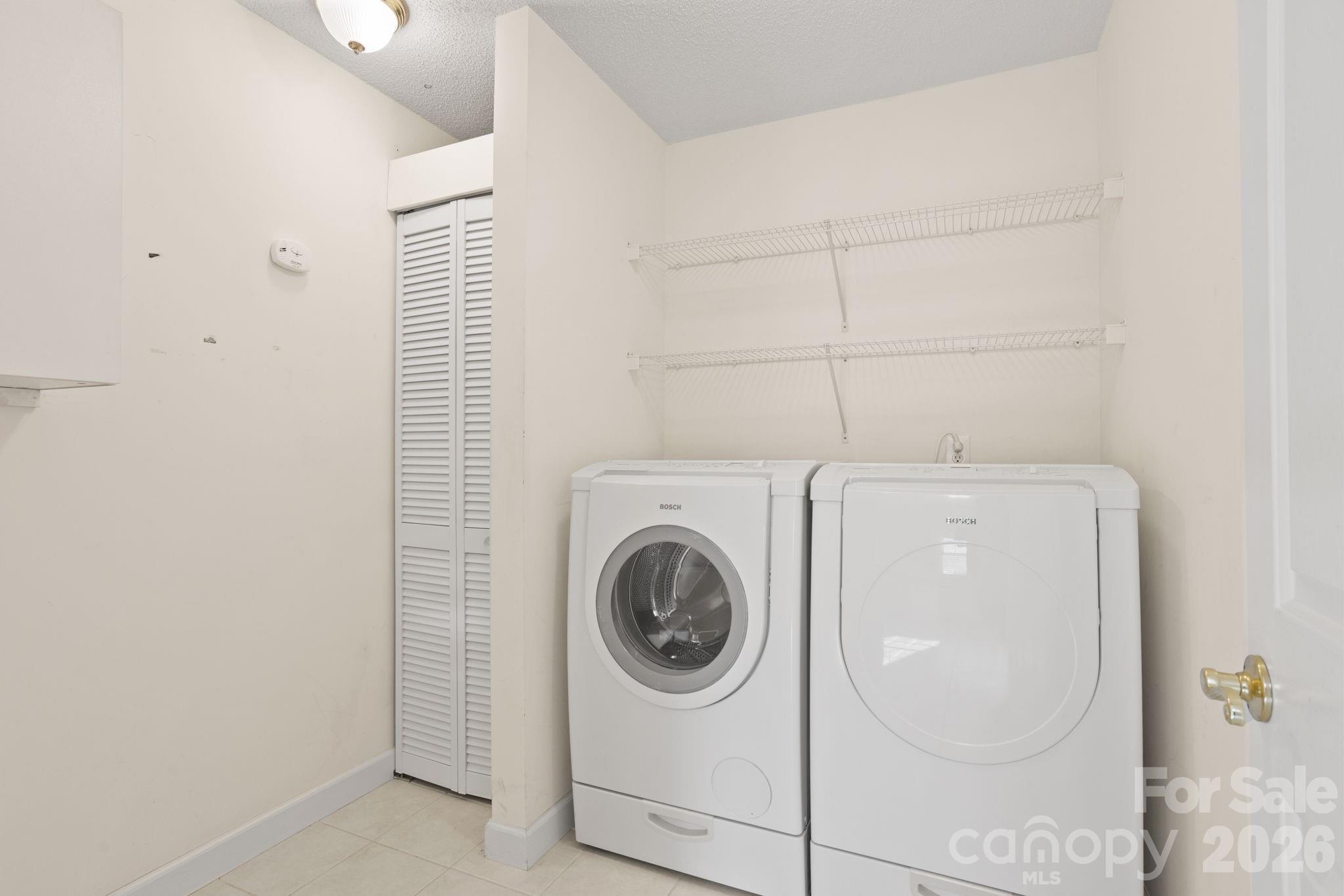 32 Stone House Road Hendersonville, NC 28739 - Photo 20 of 31 a utility room with dryer and washer