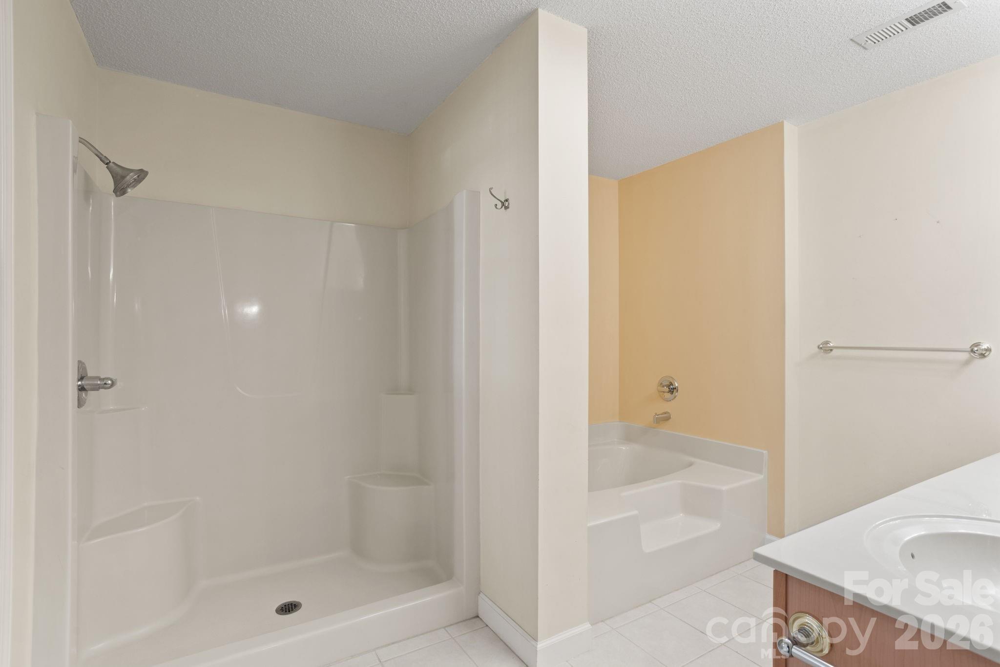 32 Stone House Road Hendersonville, NC 28739 - Photo 25 of 31 a bathroom with a granite countertop shower and a sink