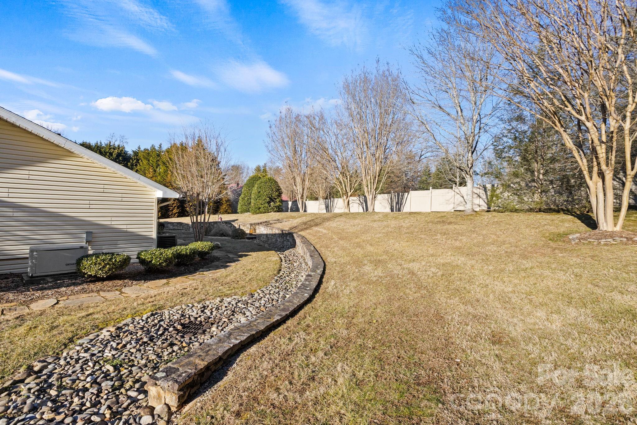 32 Stone House Road Hendersonville, NC 28739 - Photo 30 of 31 a view of large yard with a house