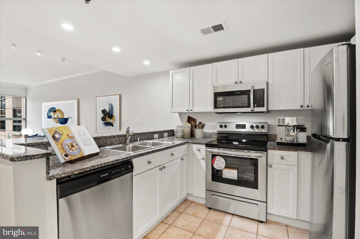 777 7th Street Northwest, Unit 630 Washington, DC 20001 - Photo 10 of 85 Gourmet Kitchen with Newly Repainted Cabinetry