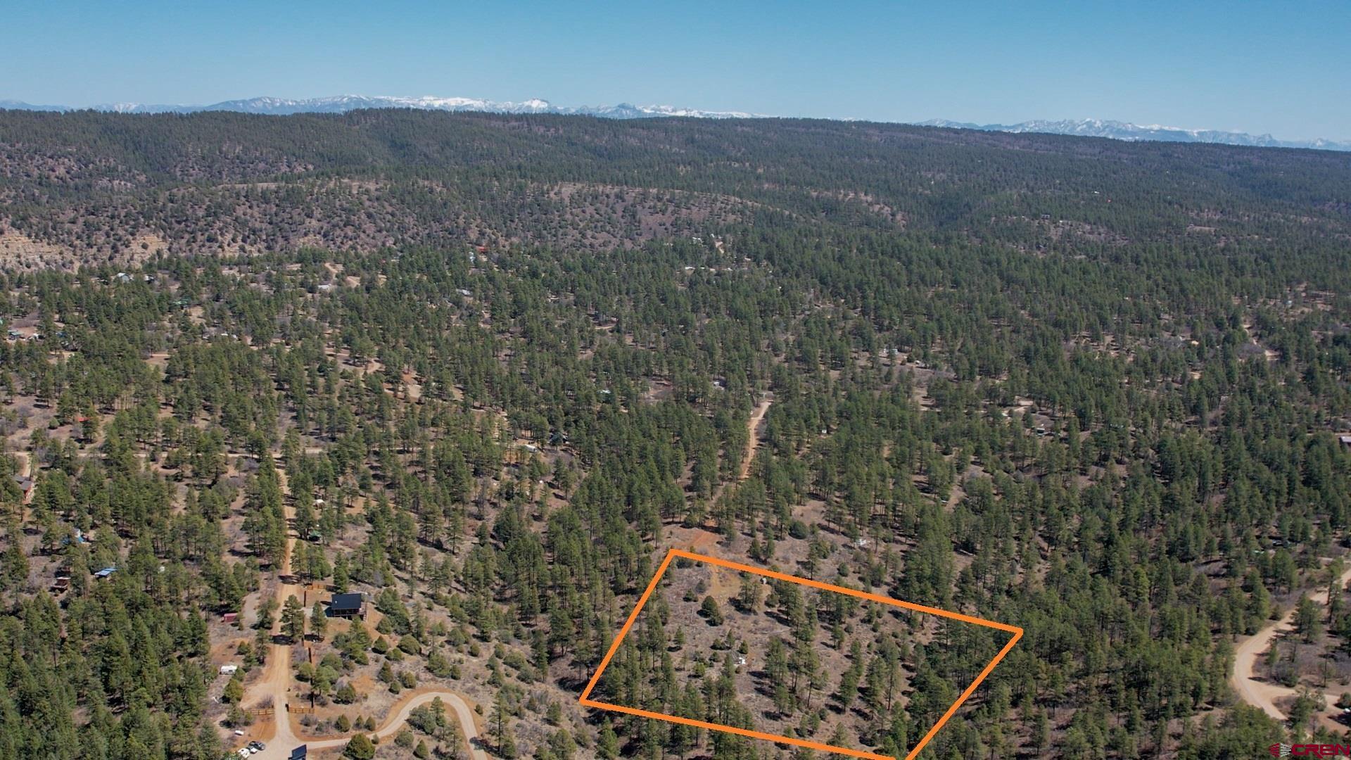149-154 Engineer Point Pagosa Springs, CO 81147 - Photo 7 of 21 a view of a dry yard with wooden fence and mountain view