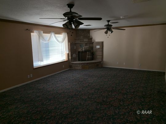 600 South Nevada Street Ridgecrest, CA 93555 - Photo 14 of 30 a view of a livingroom with a ceiling fan and window