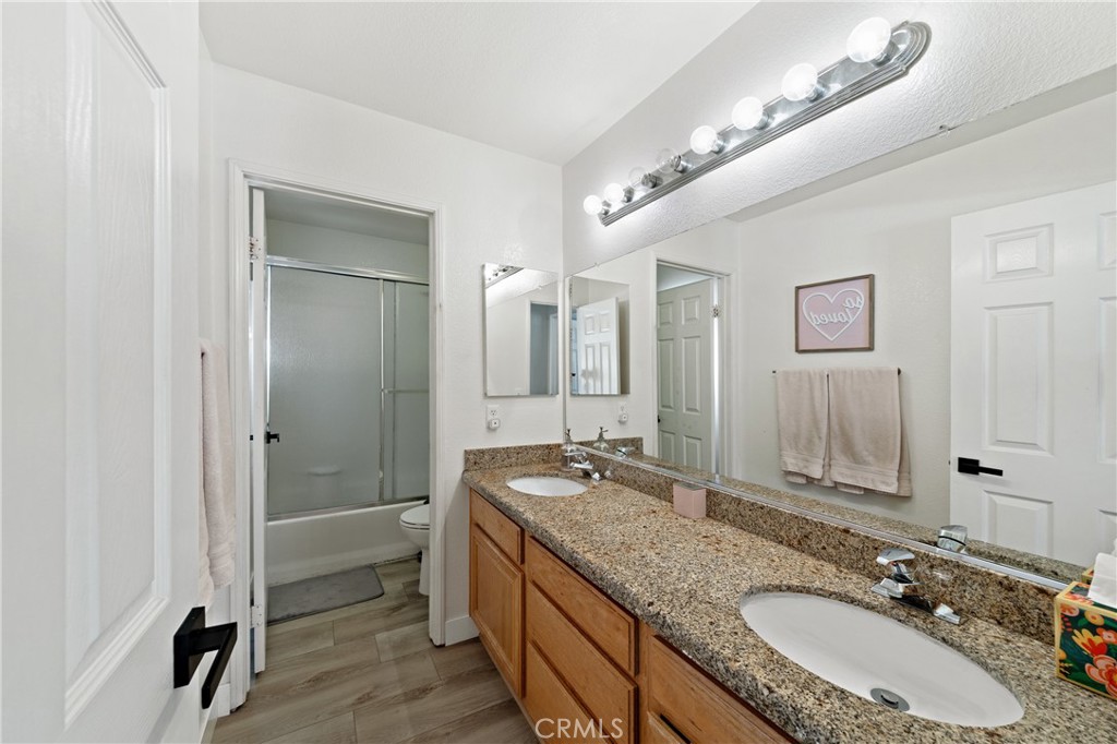32985 Novara Court Temecula, CA 92592 - Photo 34 of 56 Secondary Bathroom With Dual Sinks And Granite Countertops