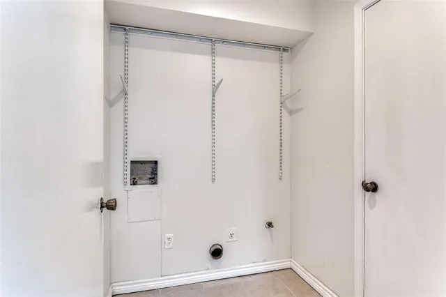 a view of a house with a yard covered in snow