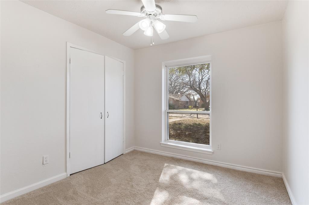 2805 Raintree Drive Plano, TX 75074 - Photo 6 of 12 an empty room with windows and fan