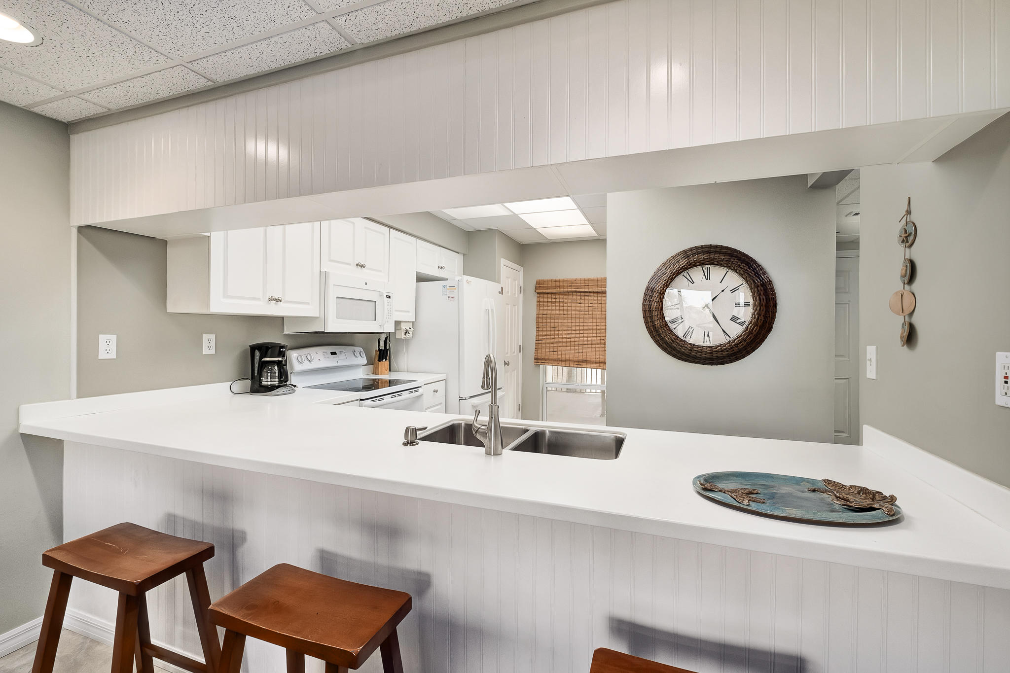 10254 East County Highway, Unit 312 Inlet Beach, FL 32461 - Photo 14 of 36 a kitchen with a sink a stove and chairs