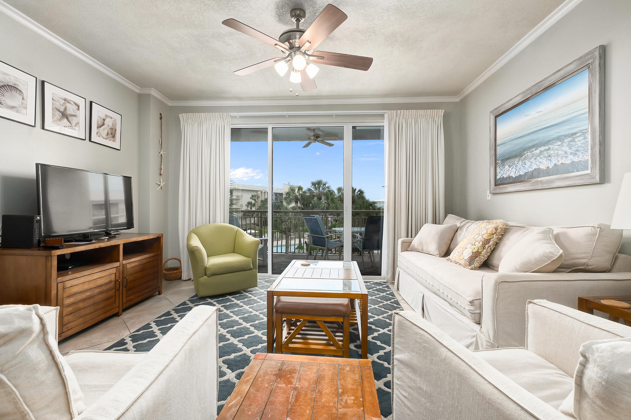 10254 East County Highway, Unit 312 Inlet Beach, FL 32461 - Photo 5 of 36 a living room with furniture two large window and a flat screen tv