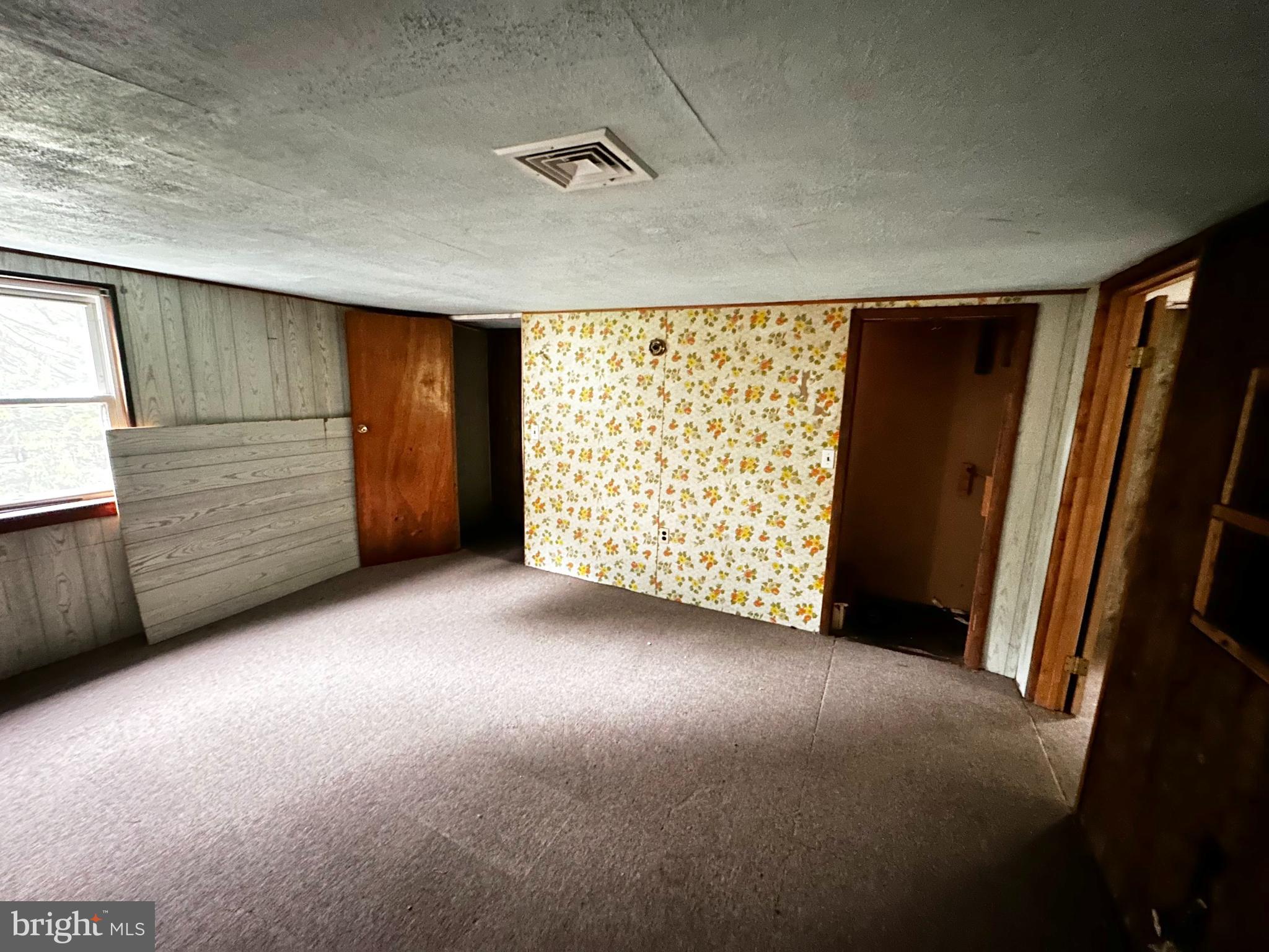 180 Buck Mountain Road Barnesville, PA 18214 - Photo 18 of 29 a view of room with window and stairs