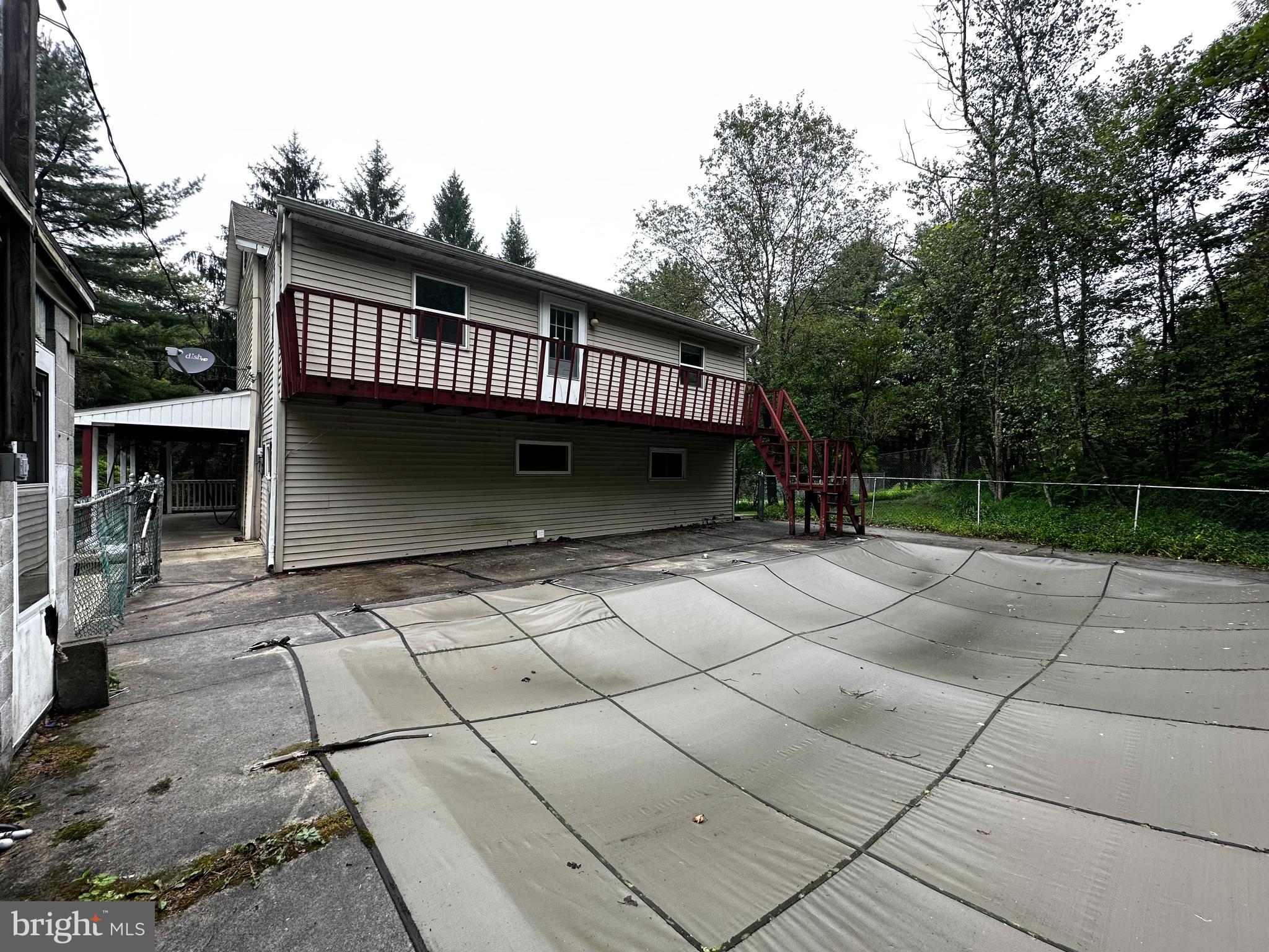 180 Buck Mountain Road Barnesville, PA 18214 - Photo 7 of 29 a view of backyard with barbeque grill and outdoor seating