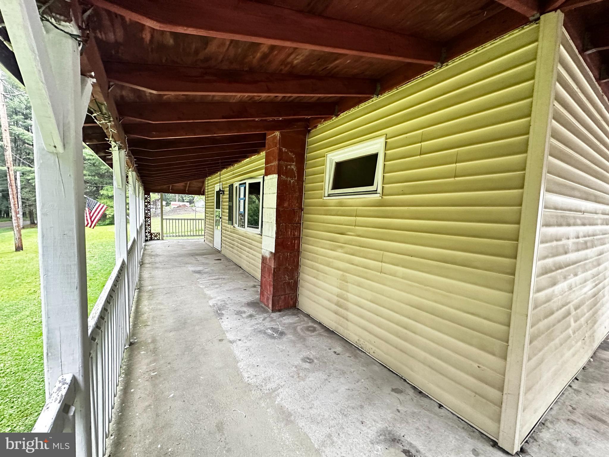 180 Buck Mountain Road Barnesville, PA 18214 - Photo 8 of 29 a view of a porch with a door