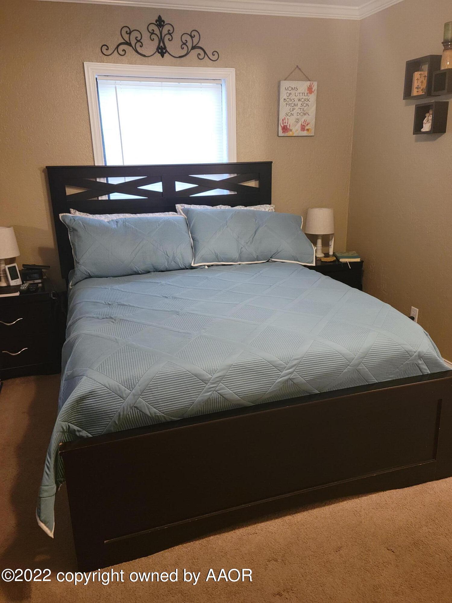 4434 South Travis Street Amarillo, TX 79110 - Photo 13 of 14 a room with a bed