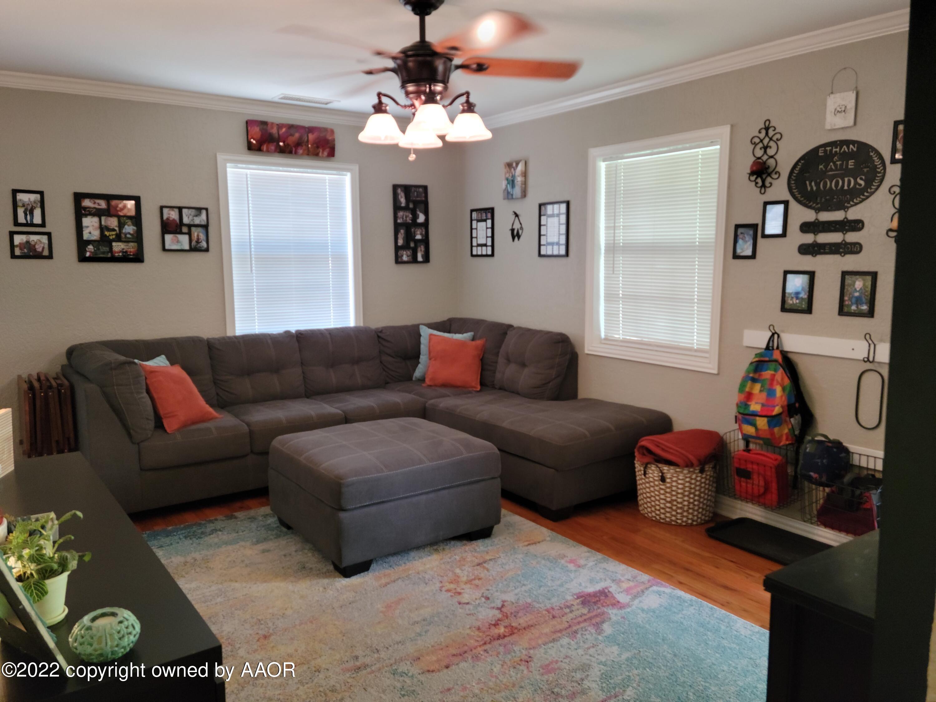 4434 South Travis Street Amarillo, TX 79110 - Photo 2 of 14 a living room with furniture and a window