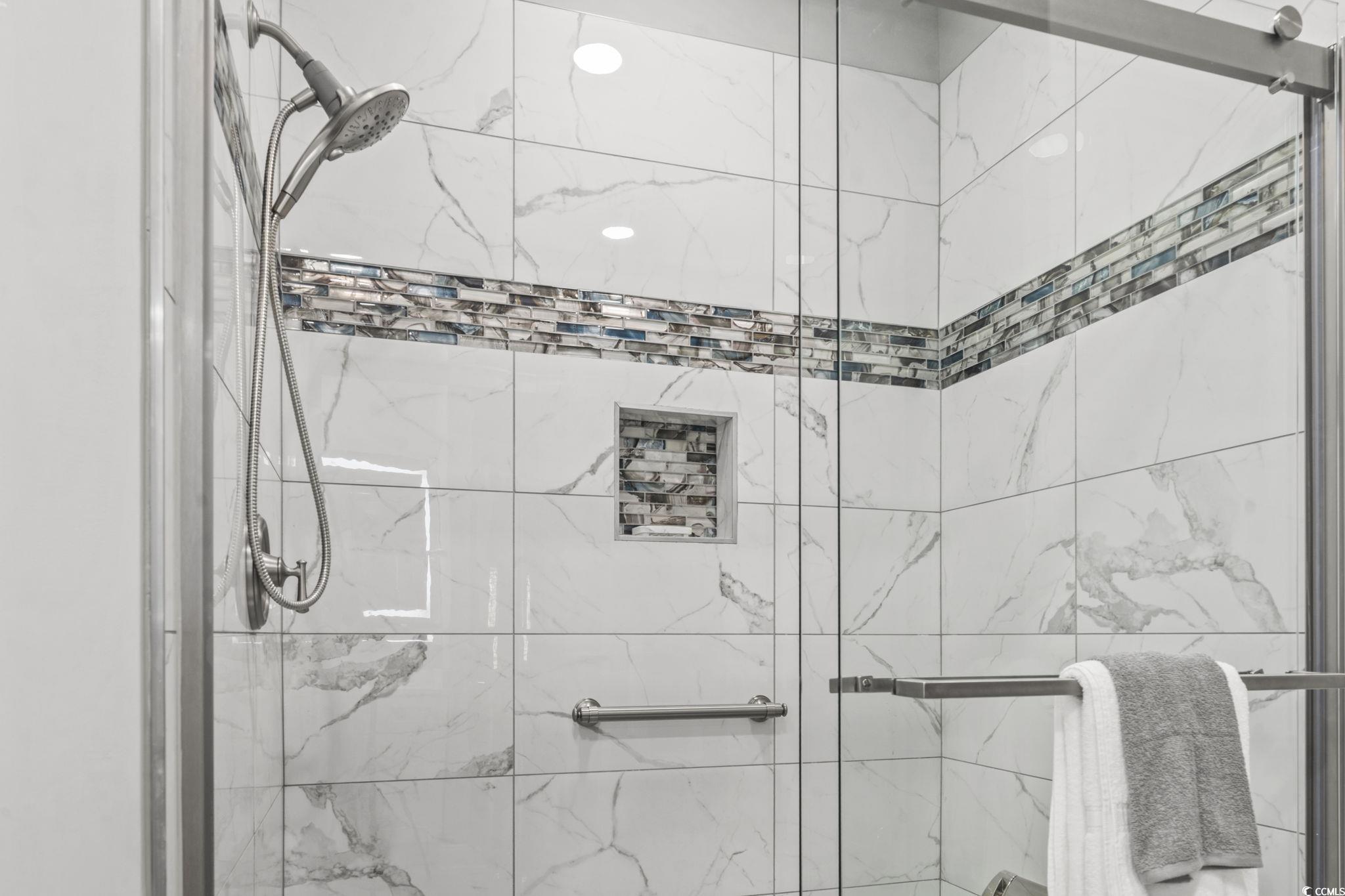 104 High Circle, Unit 8C Myrtle Beach, SC 29572 - Photo 20 of 36 Bathroom with a marble finish shower