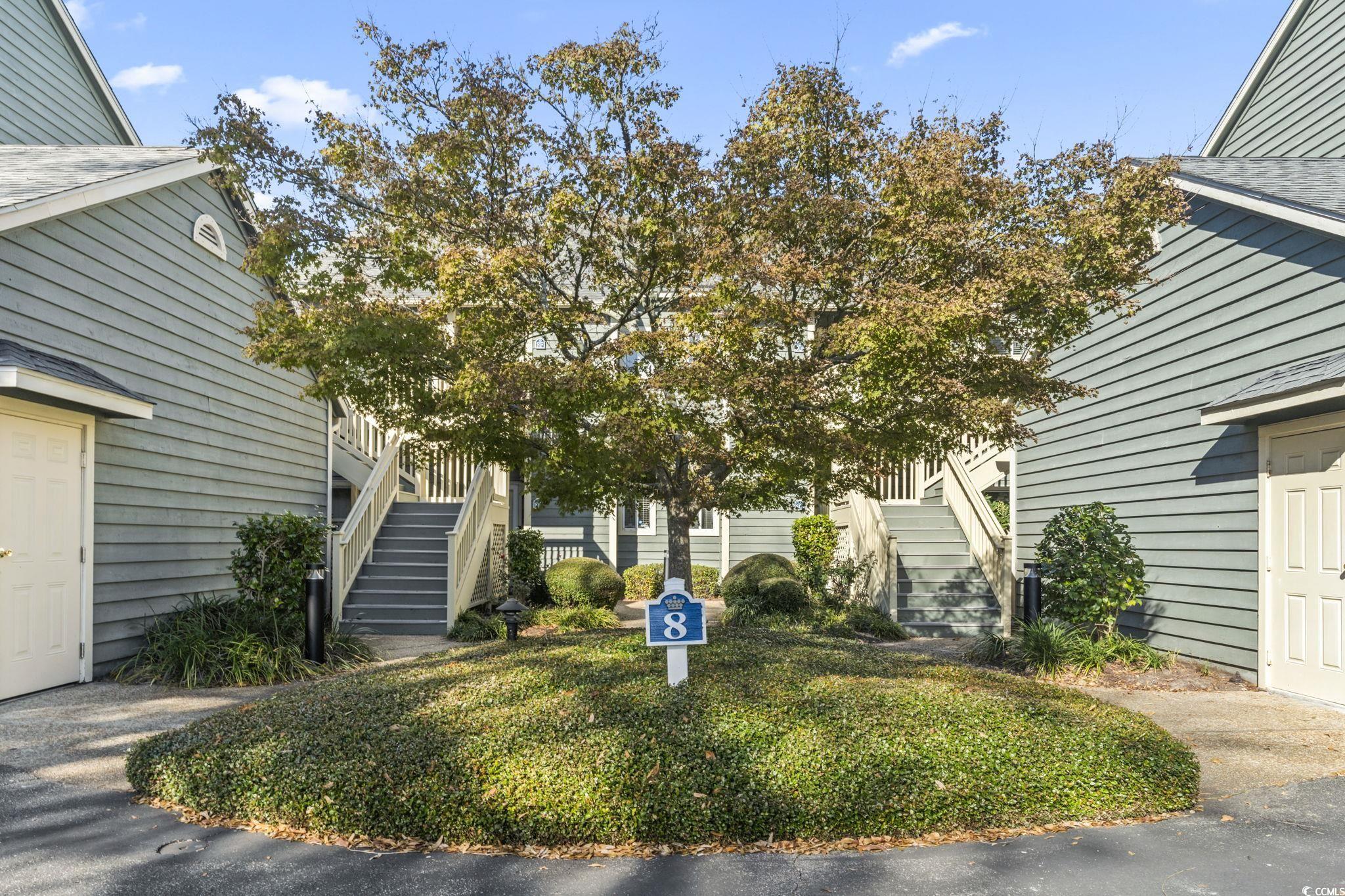 104 High Circle, Unit 8C Myrtle Beach, SC 29572 - Photo 4 of 36 View of front yard with walkway