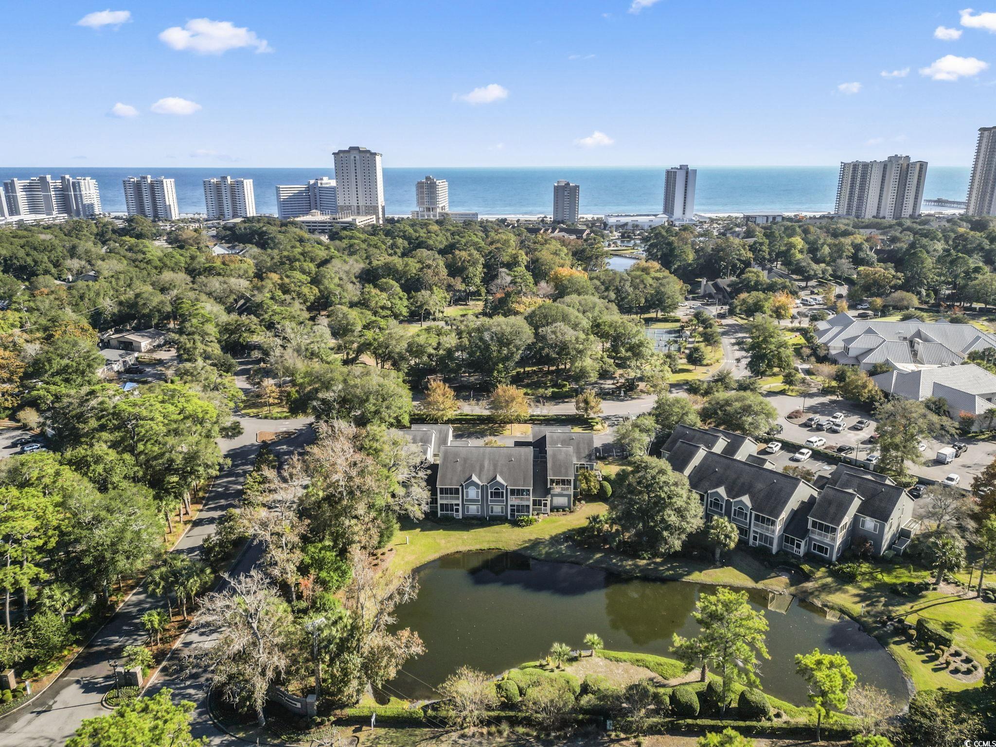 104 High Circle, Unit 8C Myrtle Beach, SC 29572 - Photo 10 of 36 View of urban area with a large body of water and a tree filled landscape