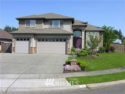 223 189th Place Southwest Bothell, WA 98012 - Photo 1 of 1 a front view of a house with a yard and potted plants