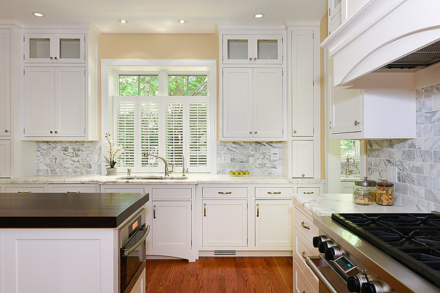102 Church Road Winnetka, IL 60093 - Photo 17 of 42 a kitchen with a sink stove and cabinets