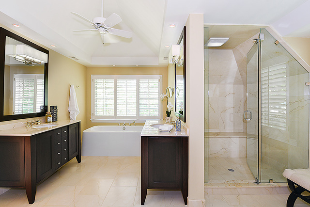 102 Church Road Winnetka, IL 60093 - Photo 25 of 42 a bathroom with a tub sink shower and mirror