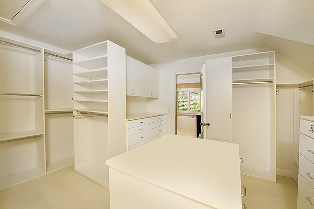 102 Church Road Winnetka, IL 60093 - Photo 27 of 42 a kitchen with a refrigerator and white cabinets