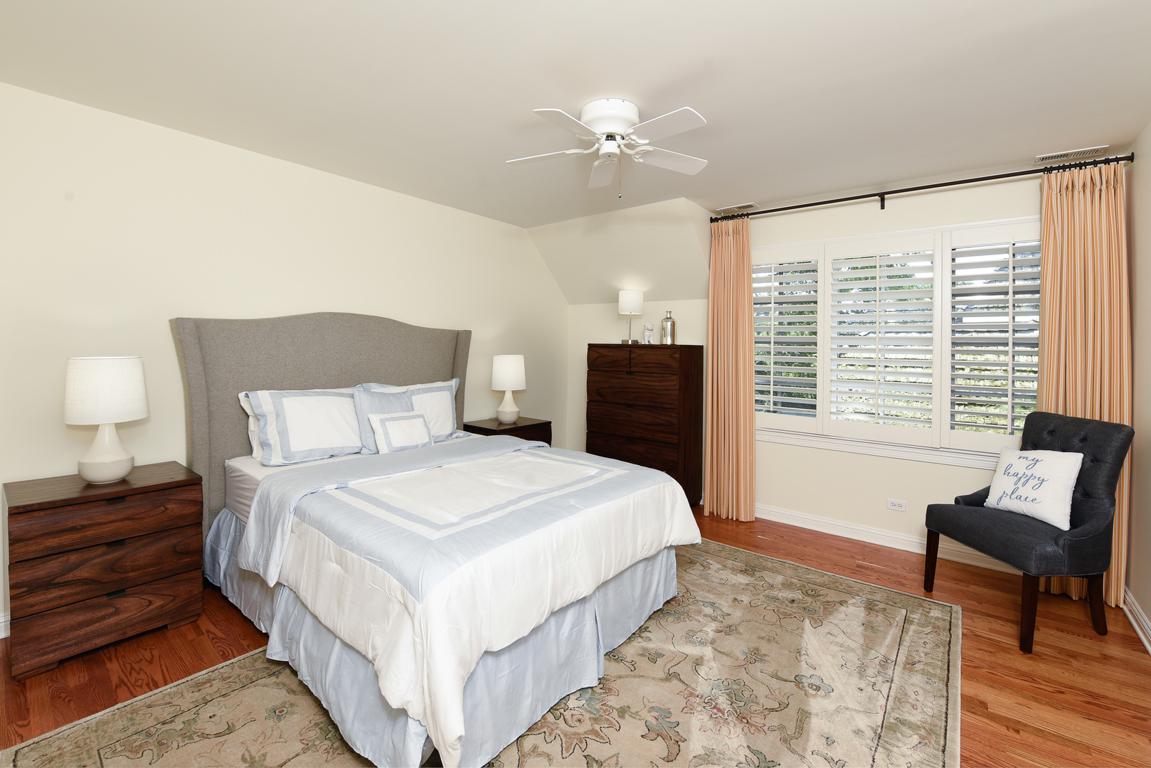 102 Church Road Winnetka, IL 60093 - Photo 28 of 42 a bedroom with a large bed and a chandelier