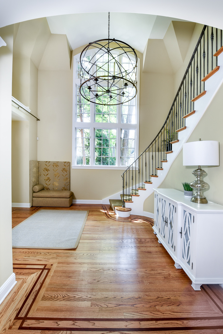 102 Church Road Winnetka, IL 60093 - Photo 4 of 42 a view of entryway and hall with wooden floor