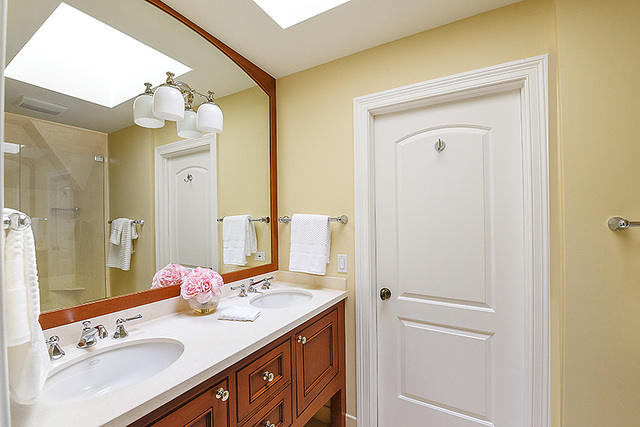 102 Church Road Winnetka, IL 60093 - Photo 31 of 42 a bathroom with a sink vanity granite and a mirror