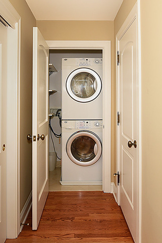 102 Church Road Winnetka, IL 60093 - Photo 33 of 42 a view of a hallway with washer and dryer