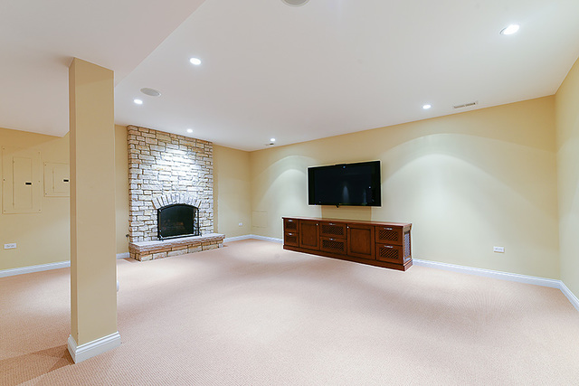 102 Church Road Winnetka, IL 60093 - Photo 36 of 42 a living room with furniture and a flat screen tv