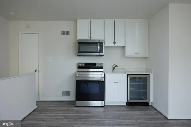 a bathroom with a sink and shower