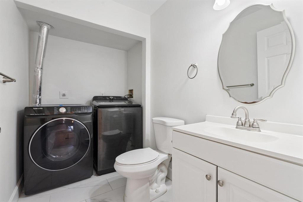 7780 Courtyard Run West Boca Raton, FL 33433 - Photo 19 of 32 Half Bathroom & Laundry