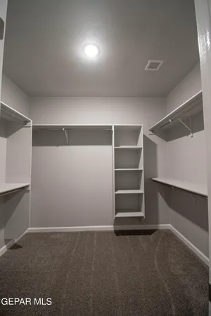 a view of an empty room with a fireplace