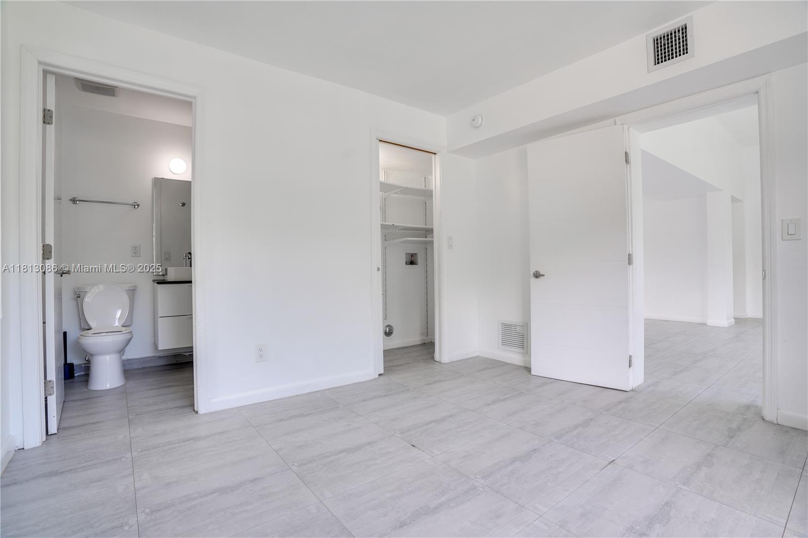 1201 South Biscayne Point Road Miami Beach, FL 33141 - Photo 11 of 35 a view of a bathroom with a toilet sink and a view of bathroom
