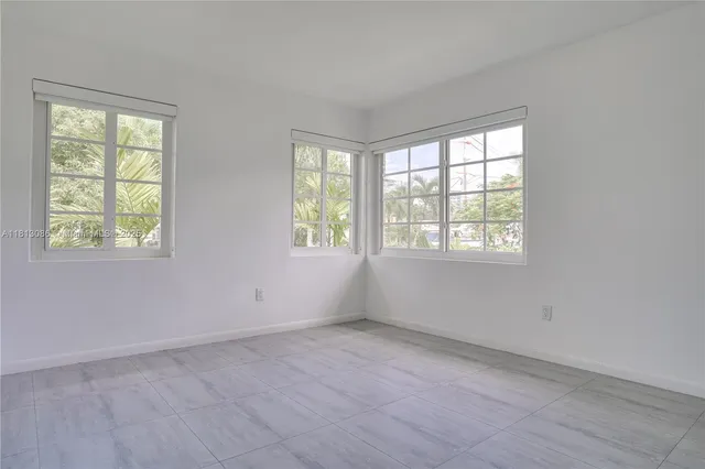 a bath room with a sink and a mirror