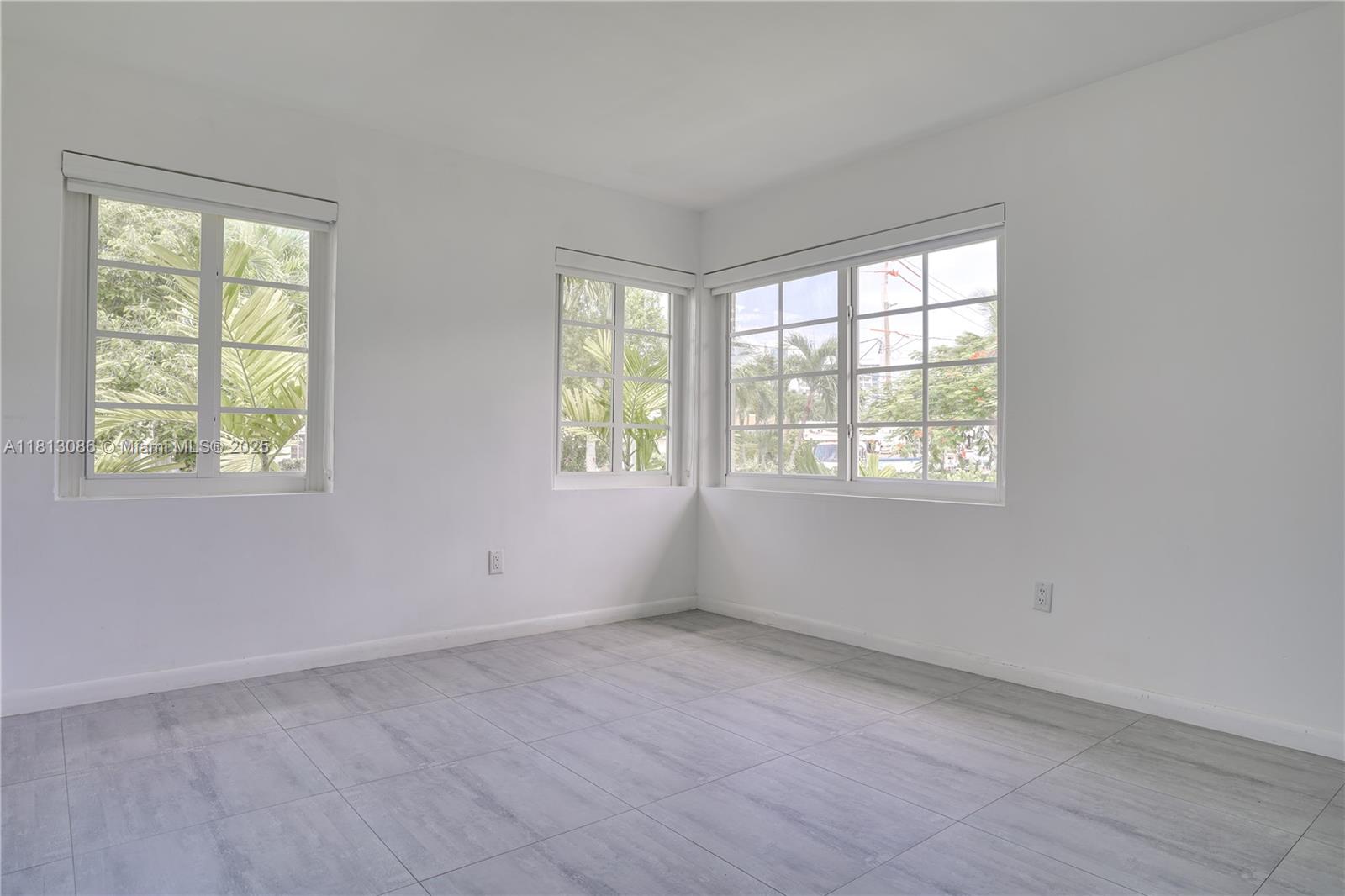 1201 South Biscayne Point Road Miami Beach, FL 33141 - Photo 16 of 35 an empty room with windows