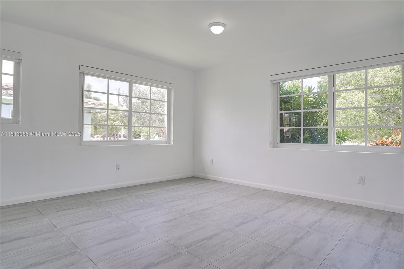 1201 South Biscayne Point Road Miami Beach, FL 33141 - Photo 18 of 35 an empty room with a window