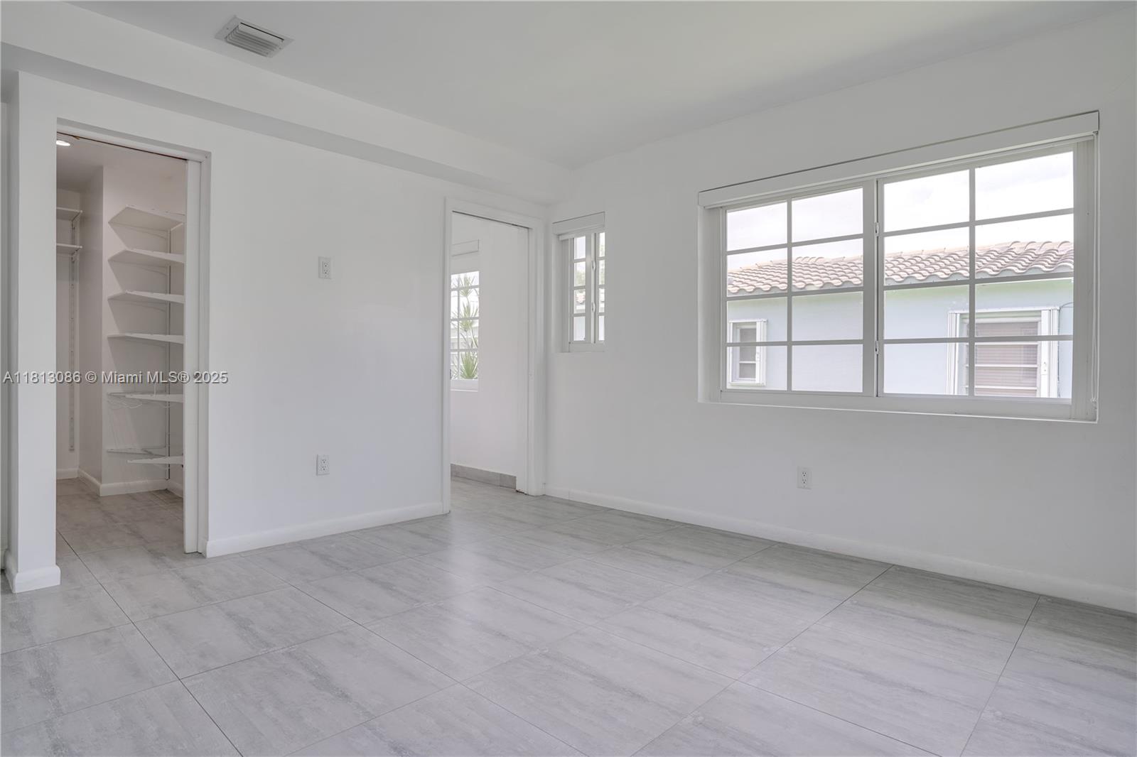 1201 South Biscayne Point Road Miami Beach, FL 33141 - Photo 19 of 35 an empty room with a window