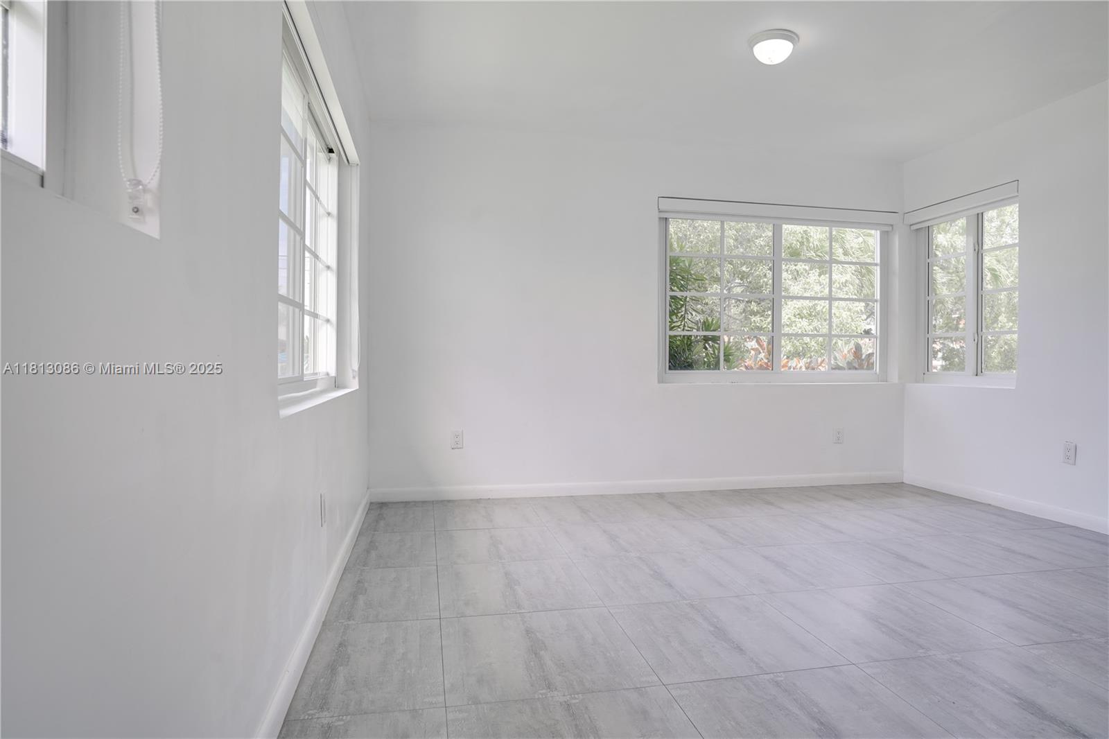 1201 South Biscayne Point Road Miami Beach, FL 33141 - Photo 22 of 35 an empty room with windows