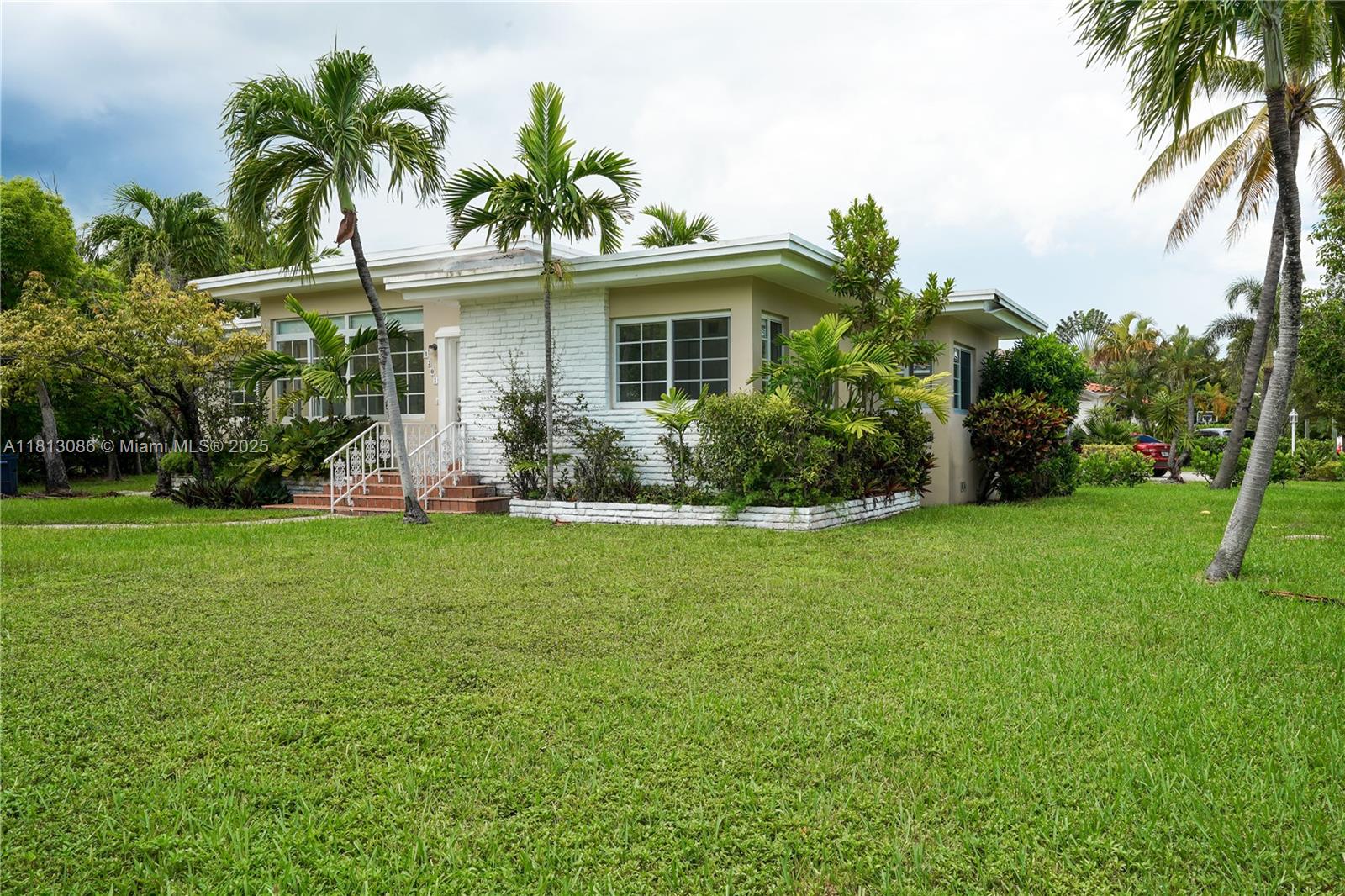 1201 South Biscayne Point Road Miami Beach, FL 33141 - Photo 25 of 35 a front view of house with yard and green space