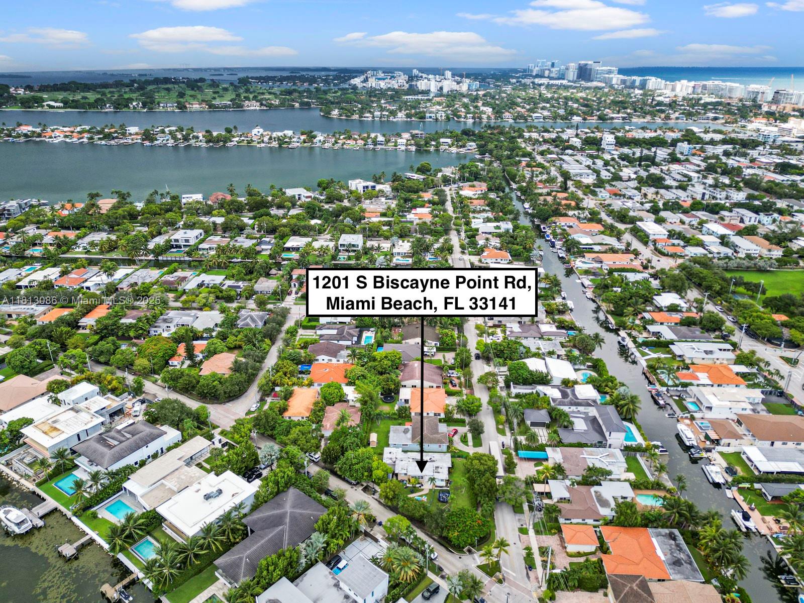 1201 South Biscayne Point Road Miami Beach, FL 33141 - Photo 33 of 35 an aerial view of a city with lots of residential buildings ocean and mountain view in back