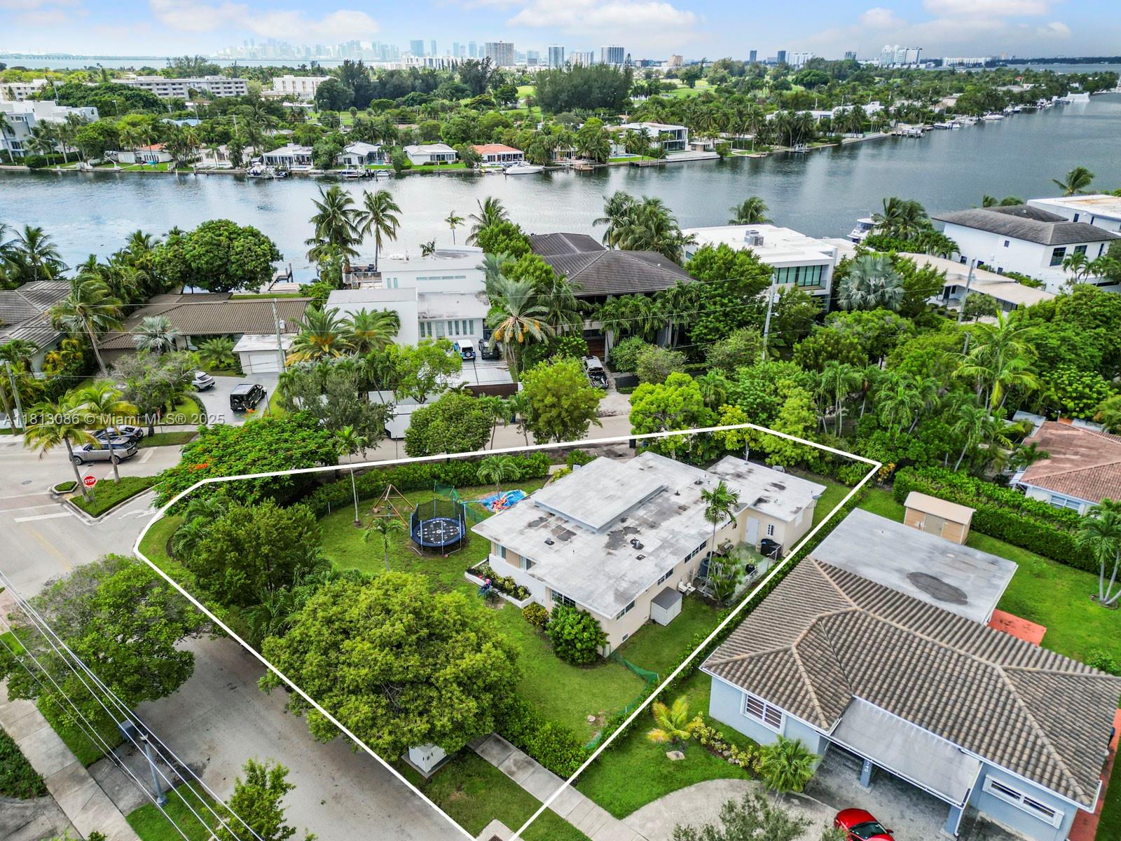 1201 South Biscayne Point Road Miami Beach, FL 33141 - Photo 4 of 35 a view of a lake with a house in the background