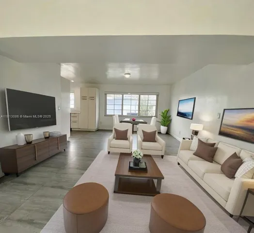 a bedroom with a large bed and a large window