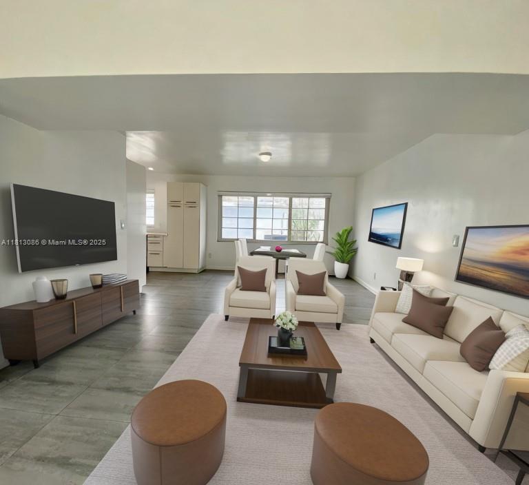 1201 South Biscayne Point Road Miami Beach, FL 33141 - Photo 5 of 35 a living room with furniture and a flat screen tv