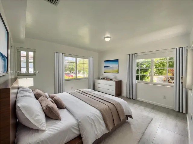 an empty room with a space and windows