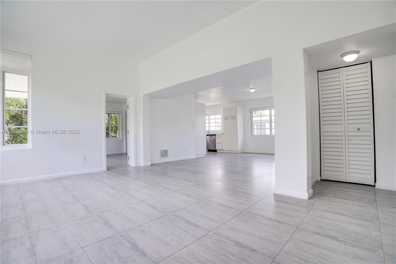 1201 South Biscayne Point Road Miami Beach, FL 33141 - Photo 8 of 35 an empty room with a space and windows