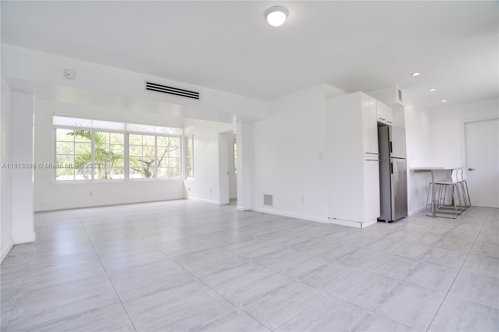 1201 South Biscayne Point Road Miami Beach, FL 33141 - Photo 9 of 35 a view of an empty room with a window