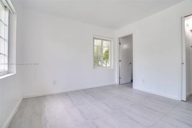 a view of a bathroom with a toilet sink and a view of bathroom