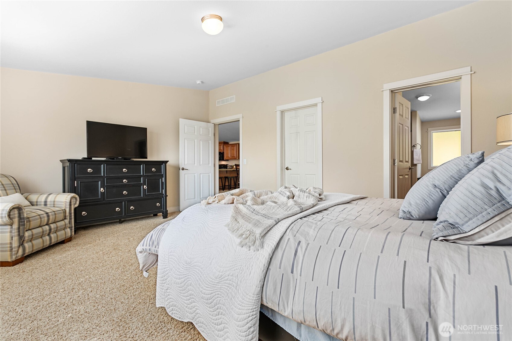 6206 Gadwa Road Ferndale, WA 98248 - Photo 24 of 37 a bedroom with a bed and a flat screen tv