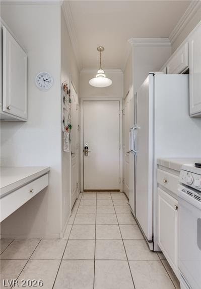 5272 Island Chain Road Las Vegas, NV 89118 - Photo 23 of 31 A well-appointed kitchen features white cabinetry and tiled flooring, offering practical living.