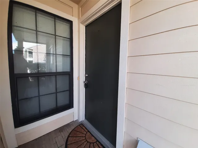 a bathroom with a glass shower door